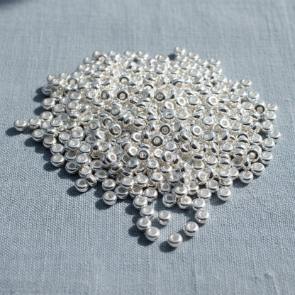 Hackberry Creek shiny silver 3mm disk beads, smooth heishi spacers, 500 pack, made of pewter with .999 fine silver plating.