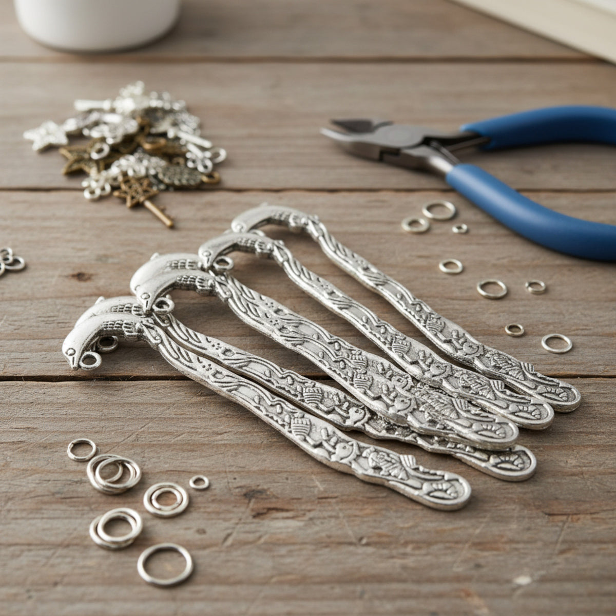 Hackberry Creek set of 5 antique silver dolphin bookmarks with beach-themed designs and charm attachment holes