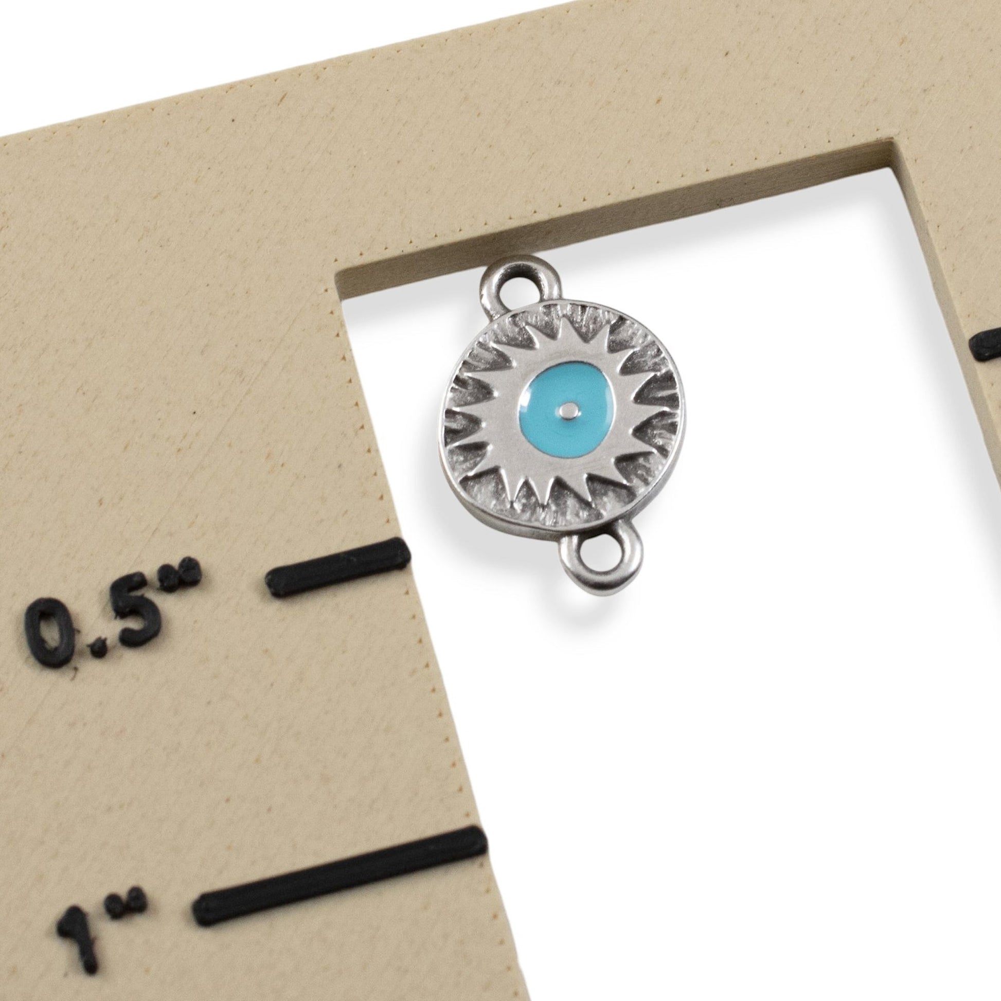 Hackberry Creek antique silver evil eye connector charm with a vibrant aqua enamel center and starburst texture.