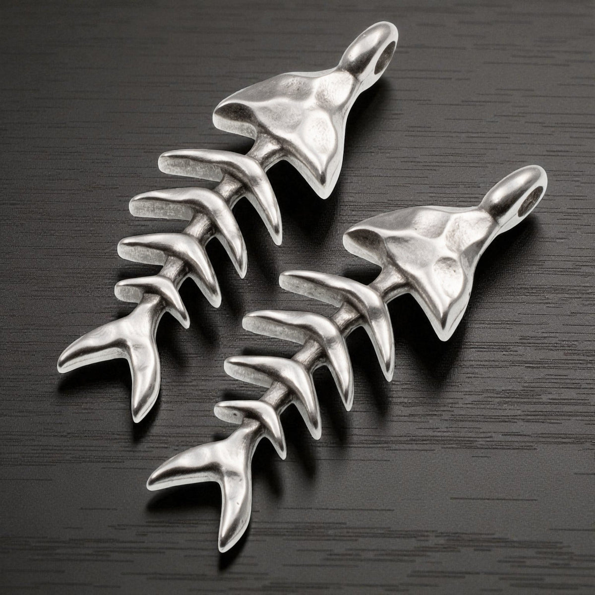 Hackberry Creek antique silver-plated fishbone skeleton pendants with detailed texture for coastal jewelry making.