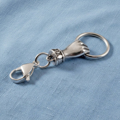 Hackberry Creek silver hand charm holder with lobster clasp for necklaces, keychains, or DIY eyeglass accessories.