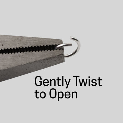 Hackberry Creek 8mm silver plated brass jump ring held by pliers, demonstrating how to twist open for jewelry making.