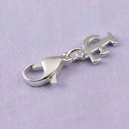 Hackberry Creek silver cursive letter F charm with a stainless steel lobster clasp for journals and bracelets.