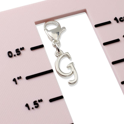 Hackberry Creek silver cursive letter G clip-on charm with lobster clasp for journals, planners, and bracelets.