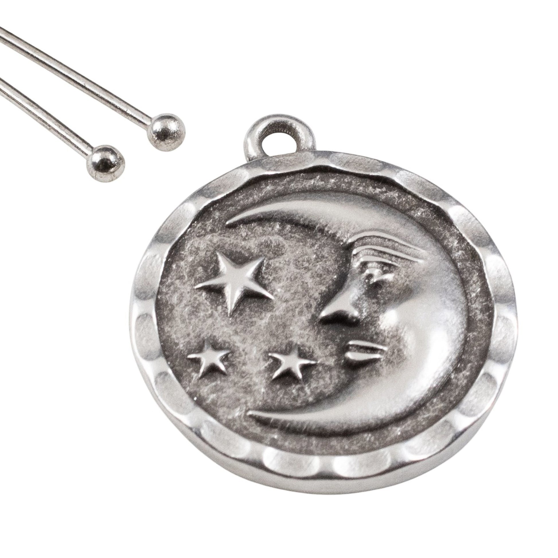 Hackberry Creek antique silver celestial pendant featuring a crescent moon and stars on a textured round charm