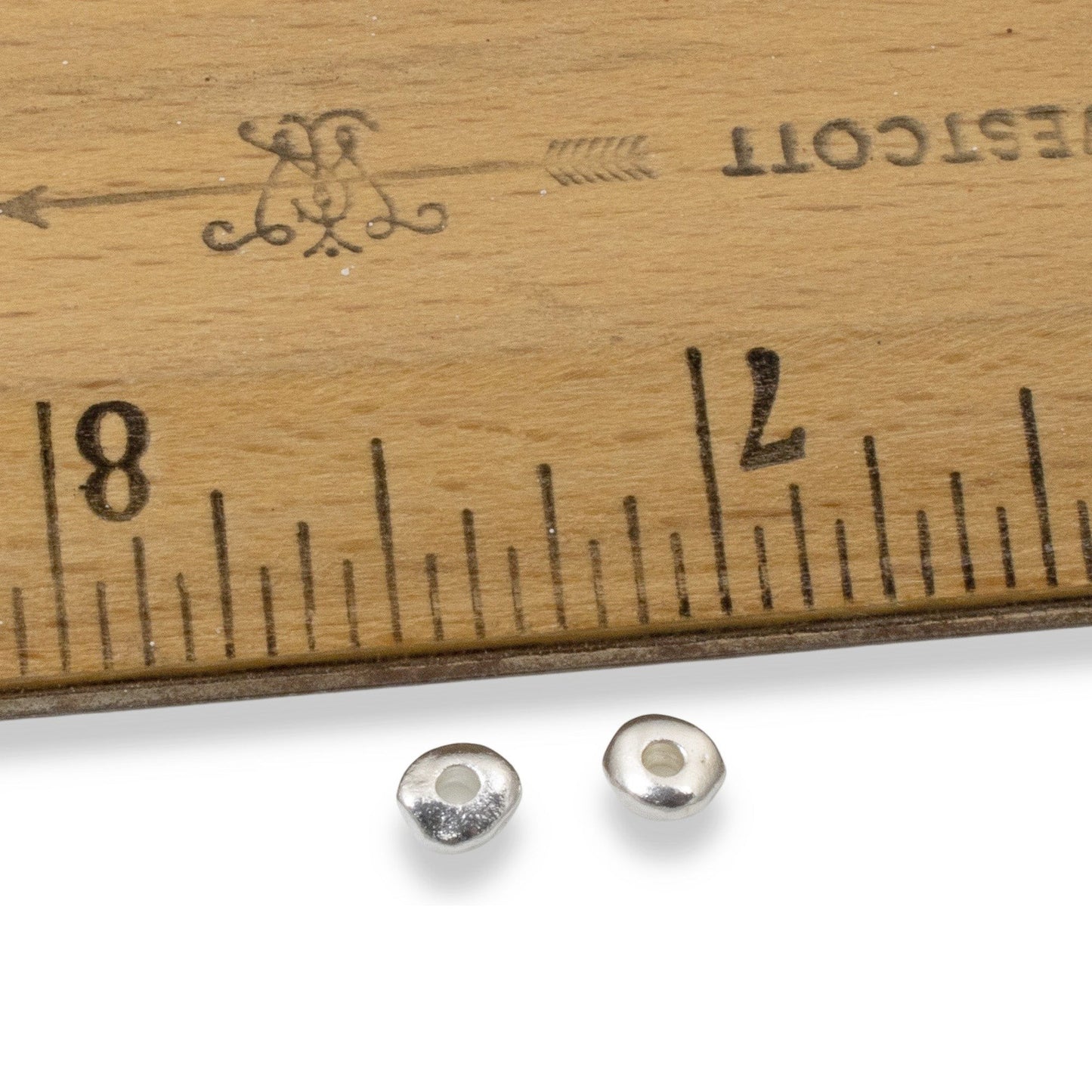 Hackberry Creek 5mm bright silver nugget beads with organic shape, ideal for handmade jewelry supplies.