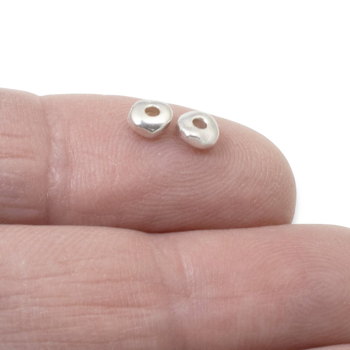 Hackberry Creek 5mm bright silver nugget spacer beads with organic shape for handmade jewelry supplies.