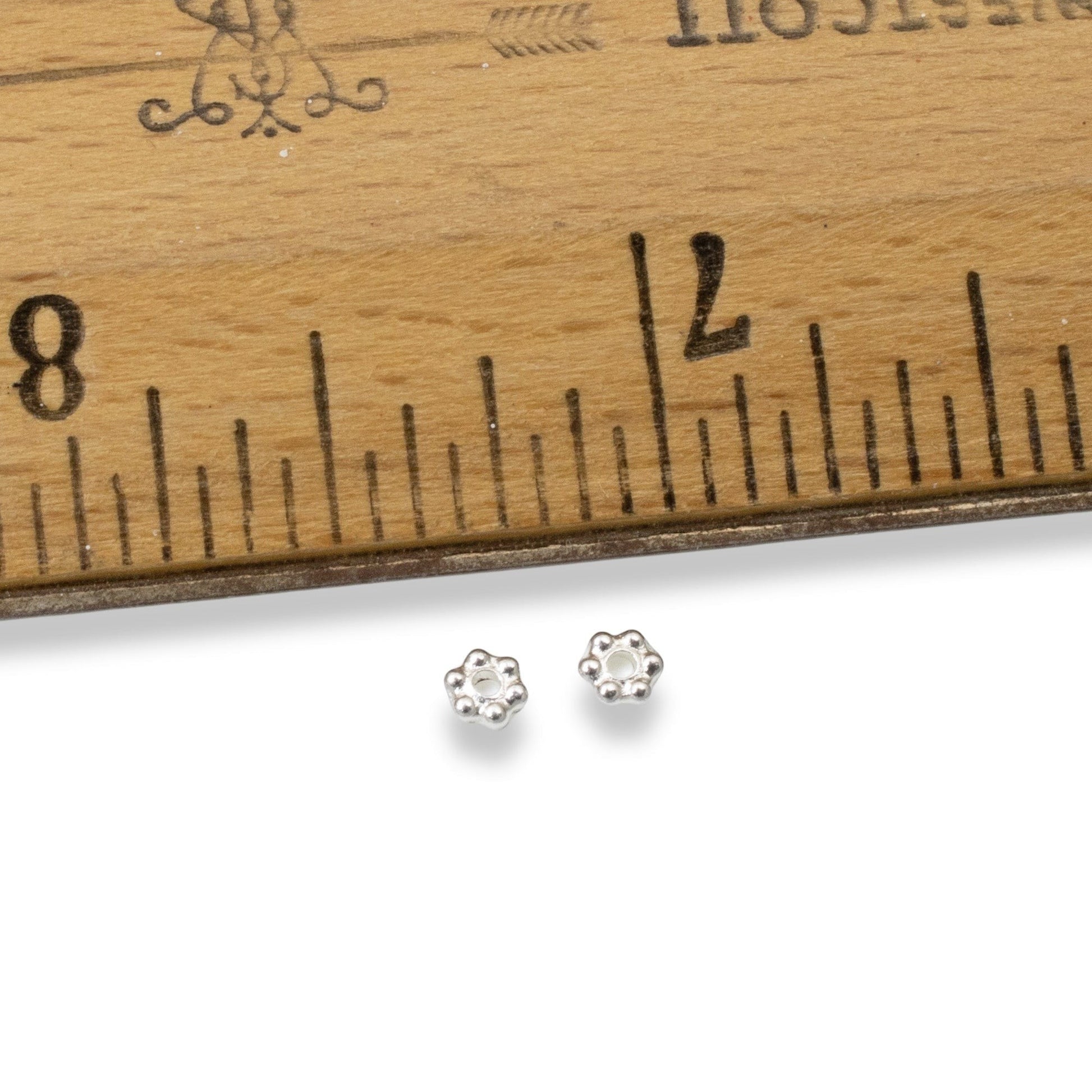 Hackberry Creek 3mm bright silver plated pewter daisy heishi spacer beads. 500 count bulk pack.