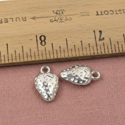 Hackberry Creek silver strawberry charms made of zinc alloy with a textured surface and a tarnish-resistant finish.