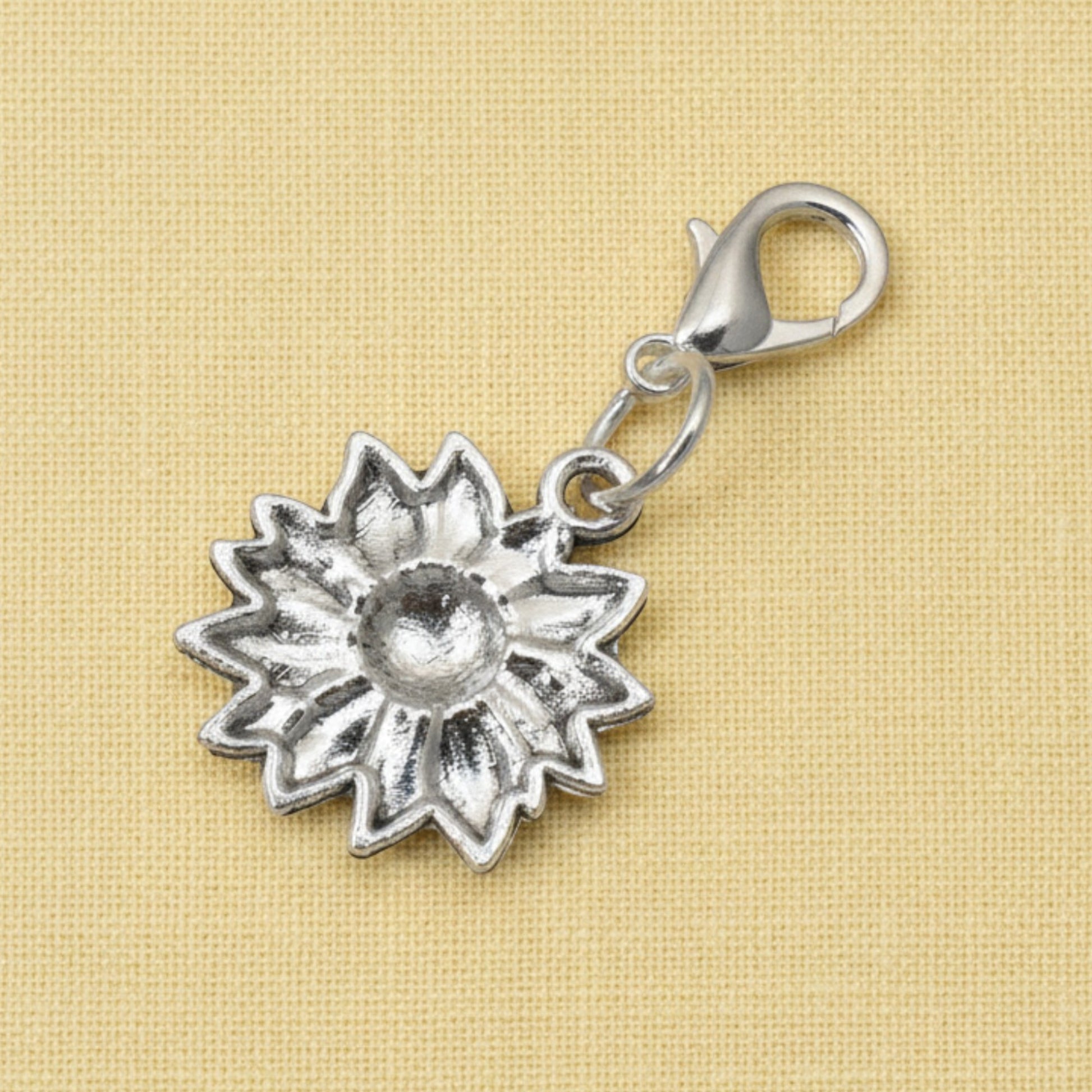 Hackberry Creek silver-plated sunflower clip-on charm for bags and journals with a secure lobster clasp