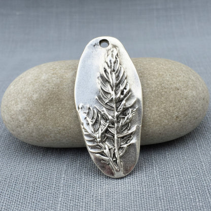 Hackberry Creek antique silver plated pewter oval pendant with a detailed tree branch design.