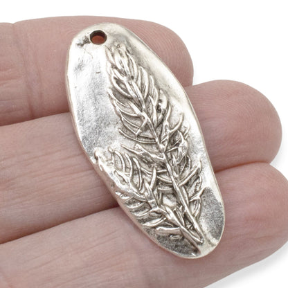 Hackberry Creek antique silver plated pewter oval pendant with a detailed tree design. Unique focal piece for jewelry.