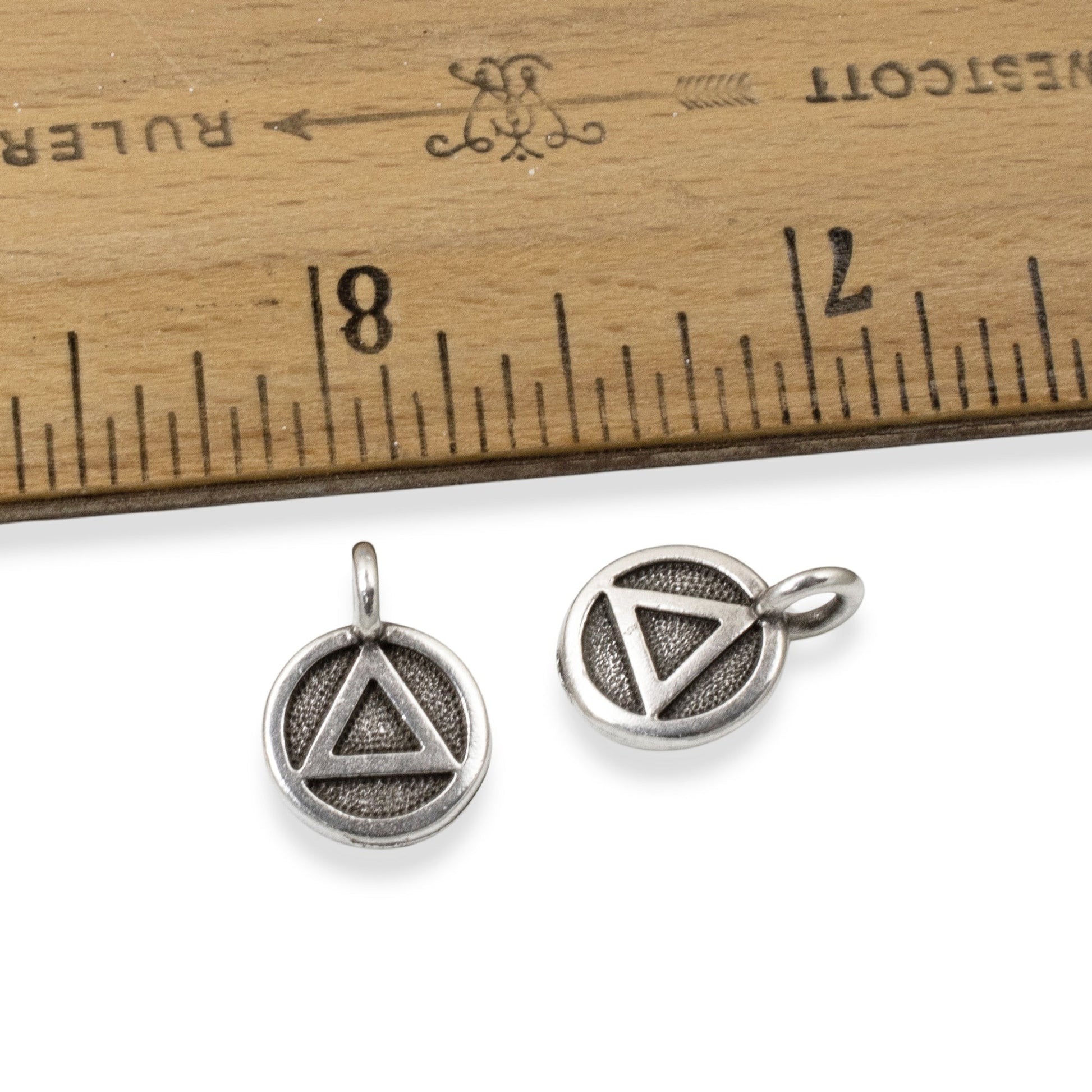 Hackberry Creek antique silver triangle recovery charms with sacred geometry symbol on leather cord.