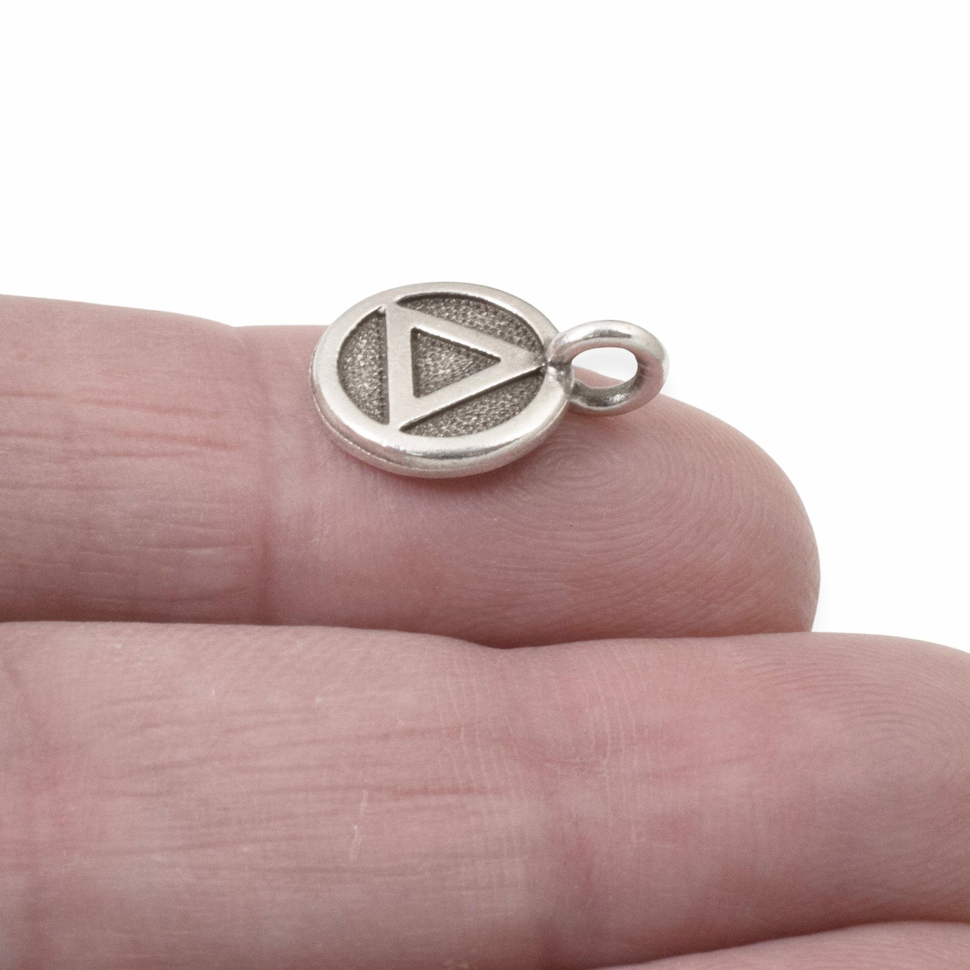 Hackberry Creek silver triangle recovery charm with antique oxidized finish, sacred geometry symbol for spiritual jewelry.
