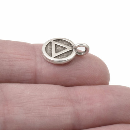 Hackberry Creek silver triangle recovery charm with antique oxidized finish, sacred geometry symbol for spiritual jewelry.