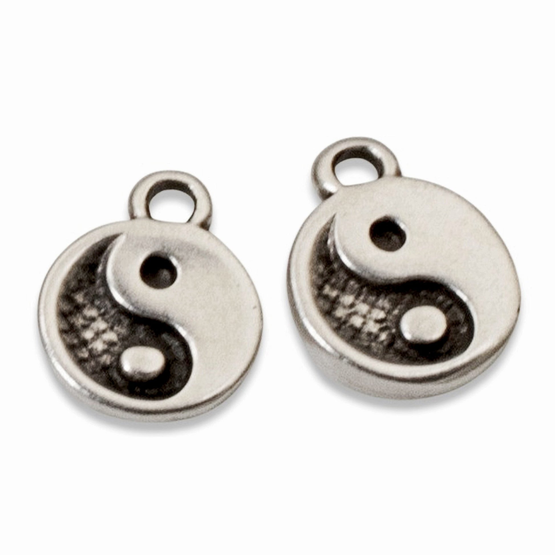 Hackberry Creek mini yin yang charms in antique silver plate for spiritual jewelry making and balance-themed designs.