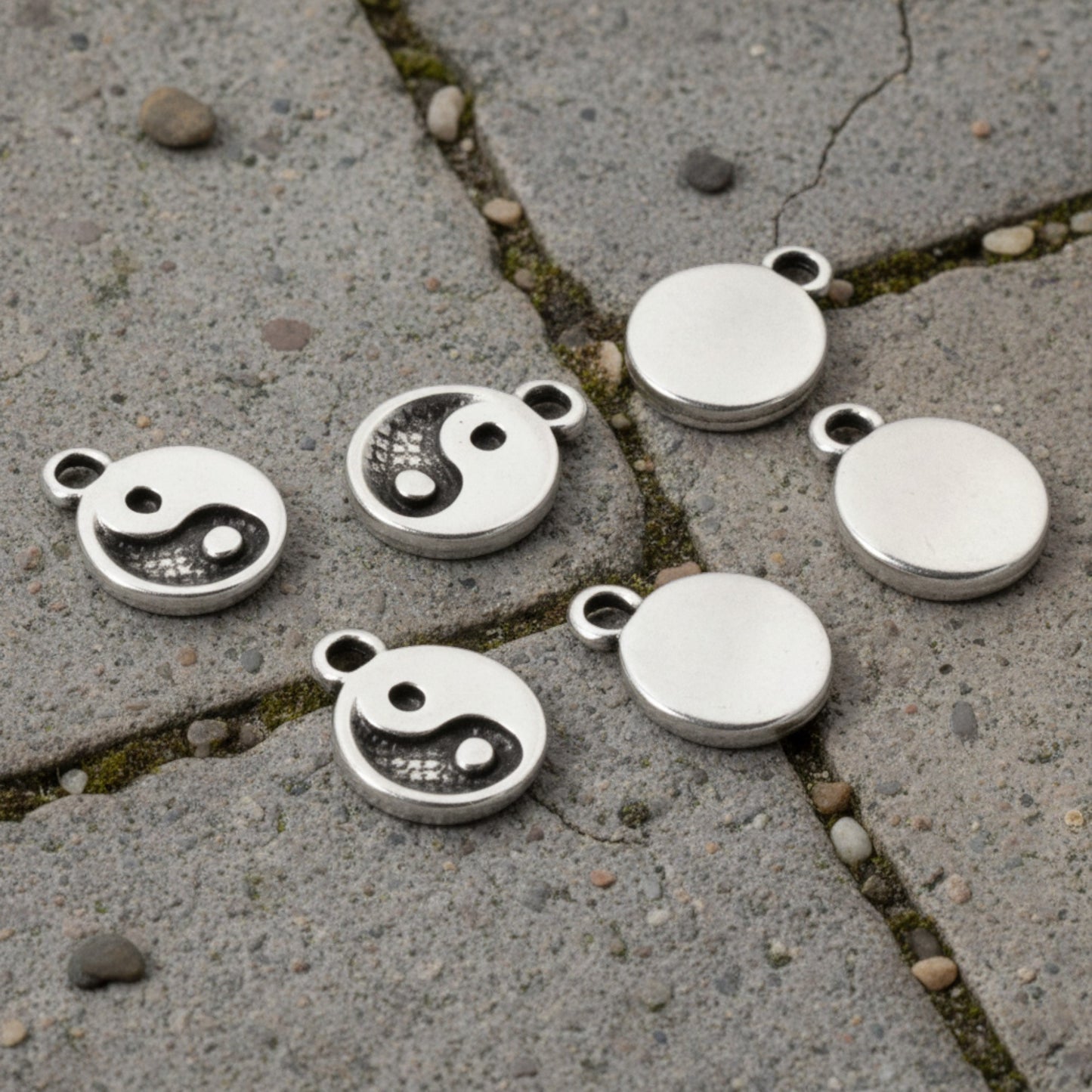 Hackberry Creek mini silver yin yang charms for jewelry making, featuring antique finish and spiritual balance symbols.