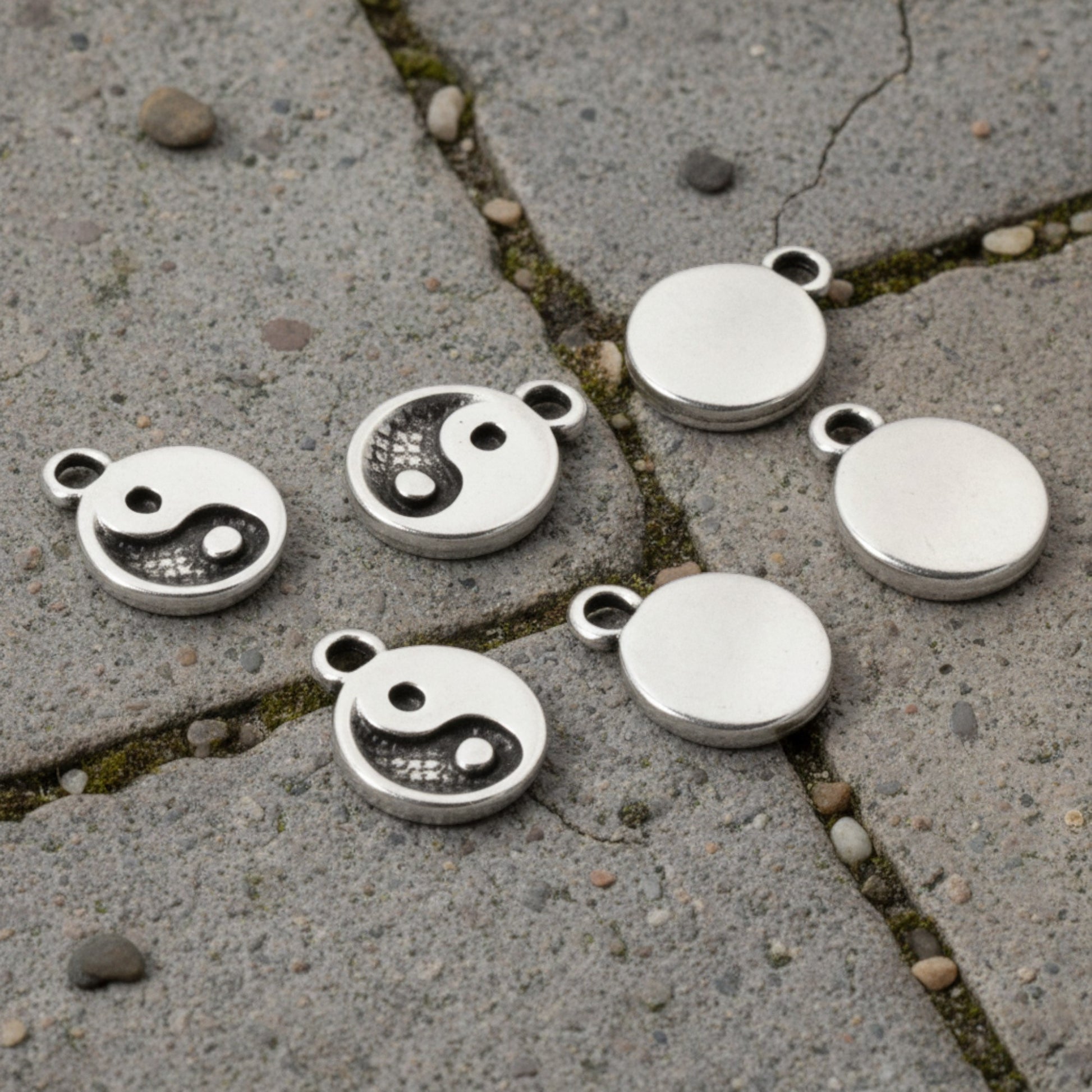 Hackberry Creek mini silver yin yang charms for jewelry making, featuring antique finish and spiritual balance symbols.
