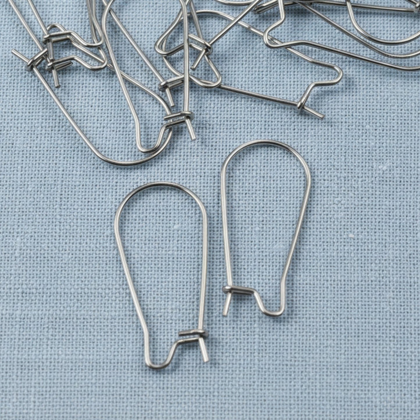 Hackberry Creek 25mm stainless steel kidney ear wires with safety hook closure, 20-pack.