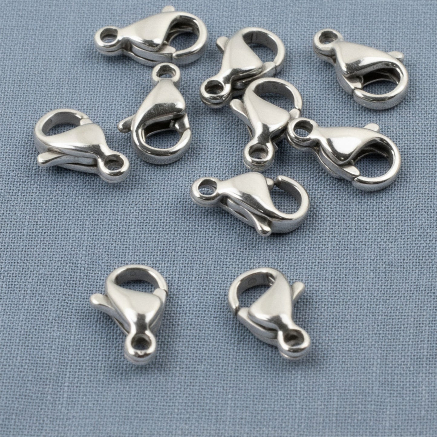 Hackberry Creek set of 10 small dark silver stainless steel lobster claw clasps for minimalist jewelry making.