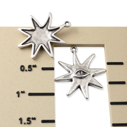 Hackberry Creek silver star eye pendants showing front and back detail on a measurement scale for jewelry making.
