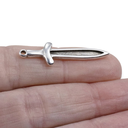 Hackberry Creek antique silver plated Zamak sword dagger charm, 11.5mm x 38.5mm, double-sided with recessed front for enamel.