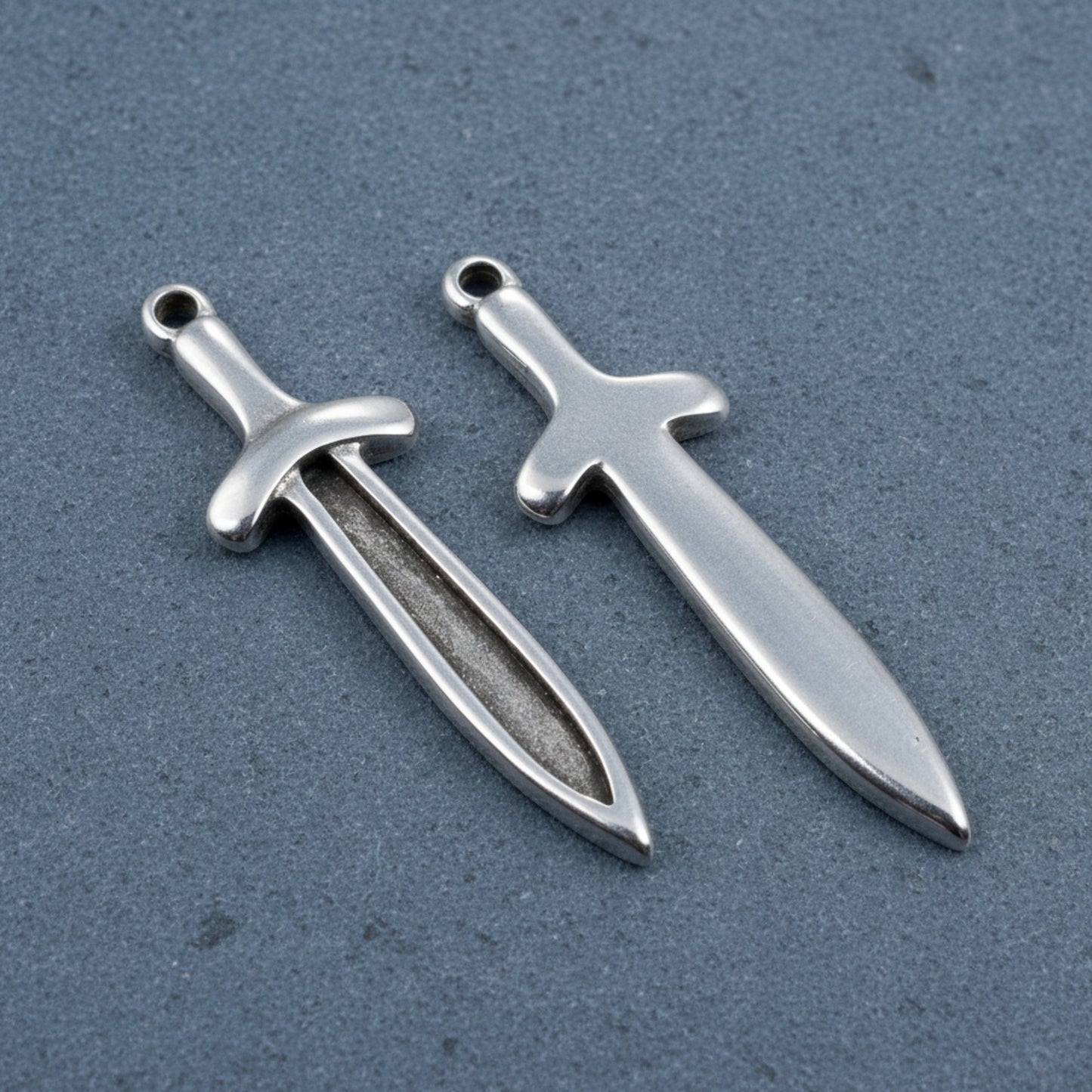 Hackberry Creek antique silver plated Zamak sword dagger charms, 11.5mm x 38.5mm, double-sided with recessed front for enamel.
