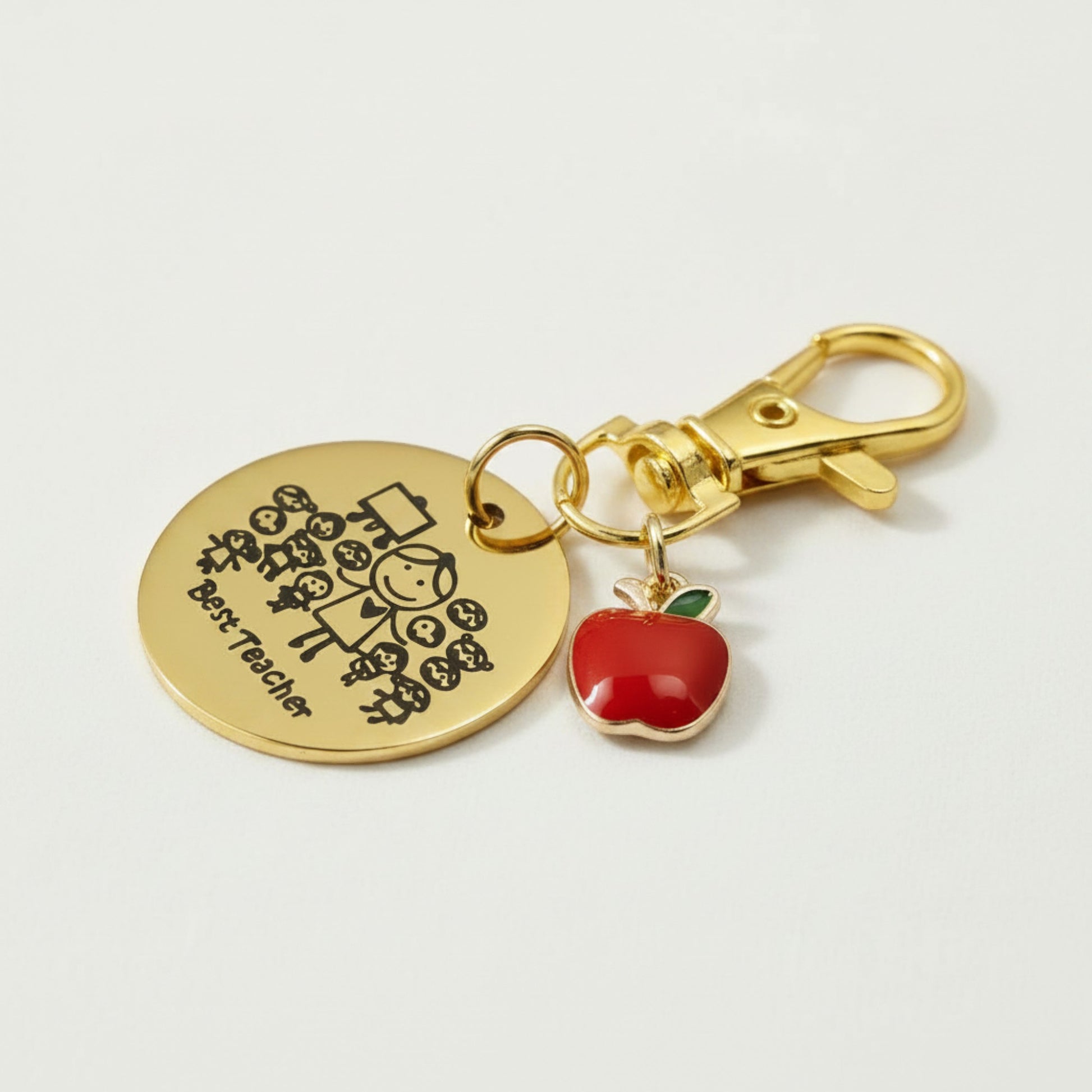 Hackberry Creek gold stainless steel Best Teacher bag charm with a red enamel apple and swivel clasp