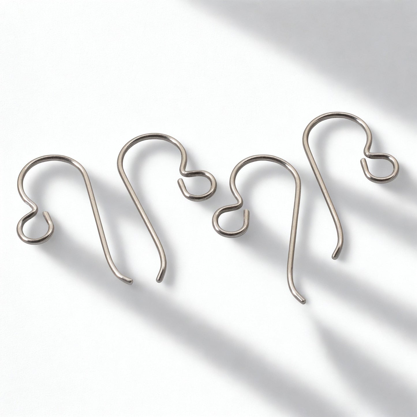 Hackberry Creek 50-pack of hypoallergenic titanium ear wires in steel gray, 10mm x 21mm, 20-gauge wire, USA made.