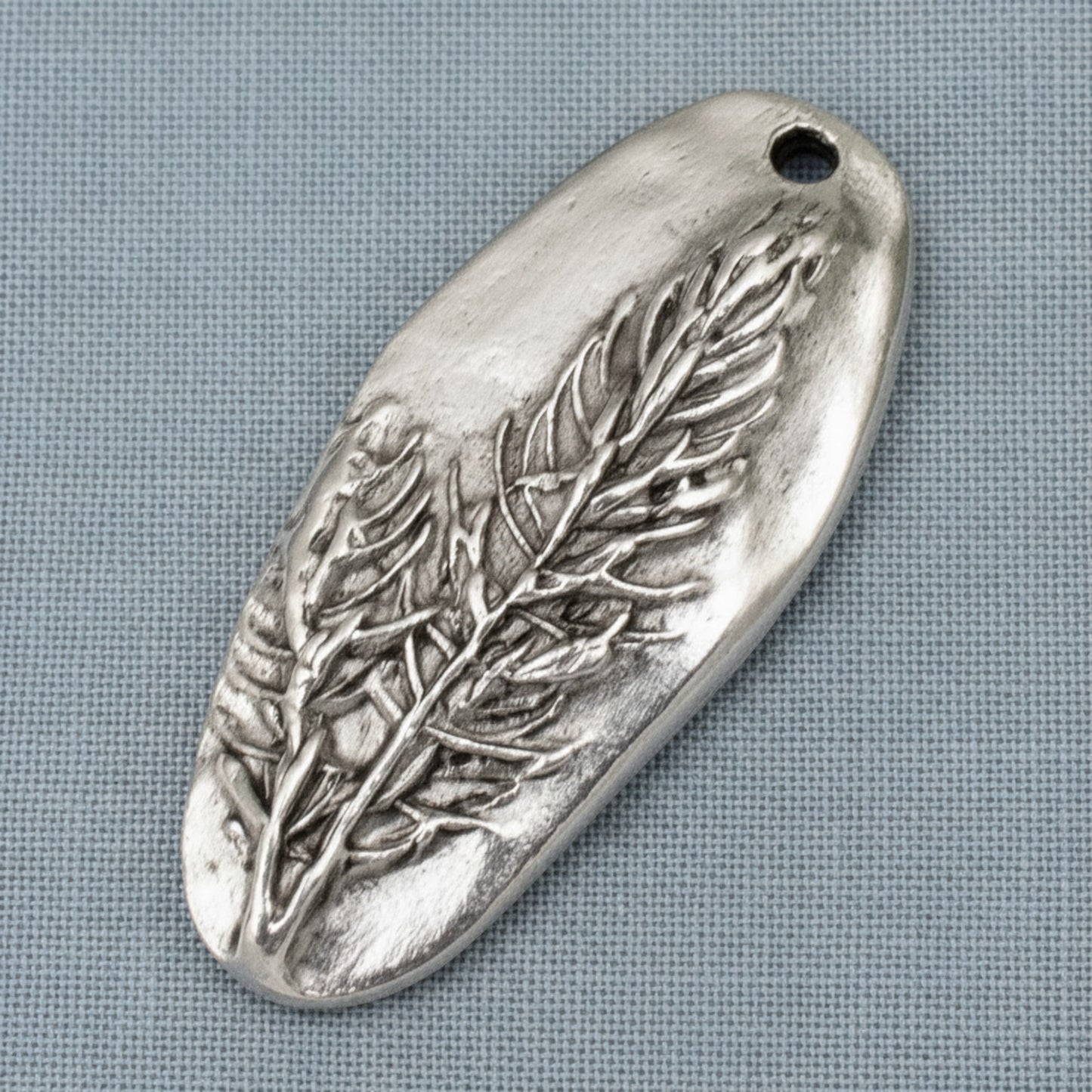 Hackberry Creek antique silver plated pewter oval pendant with a detailed tree design. Unique focal piece for jewelry making.