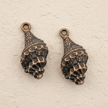 Hackberry Creek 2pcs copper-plated pewter trumpet shell charms with intricate detailing, 21mm.