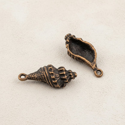 Hackberry Creek 2pcs copper plated pewter trumpet shell charms with intricate detailing, 21mm, for DIY beach nautical jewelry.