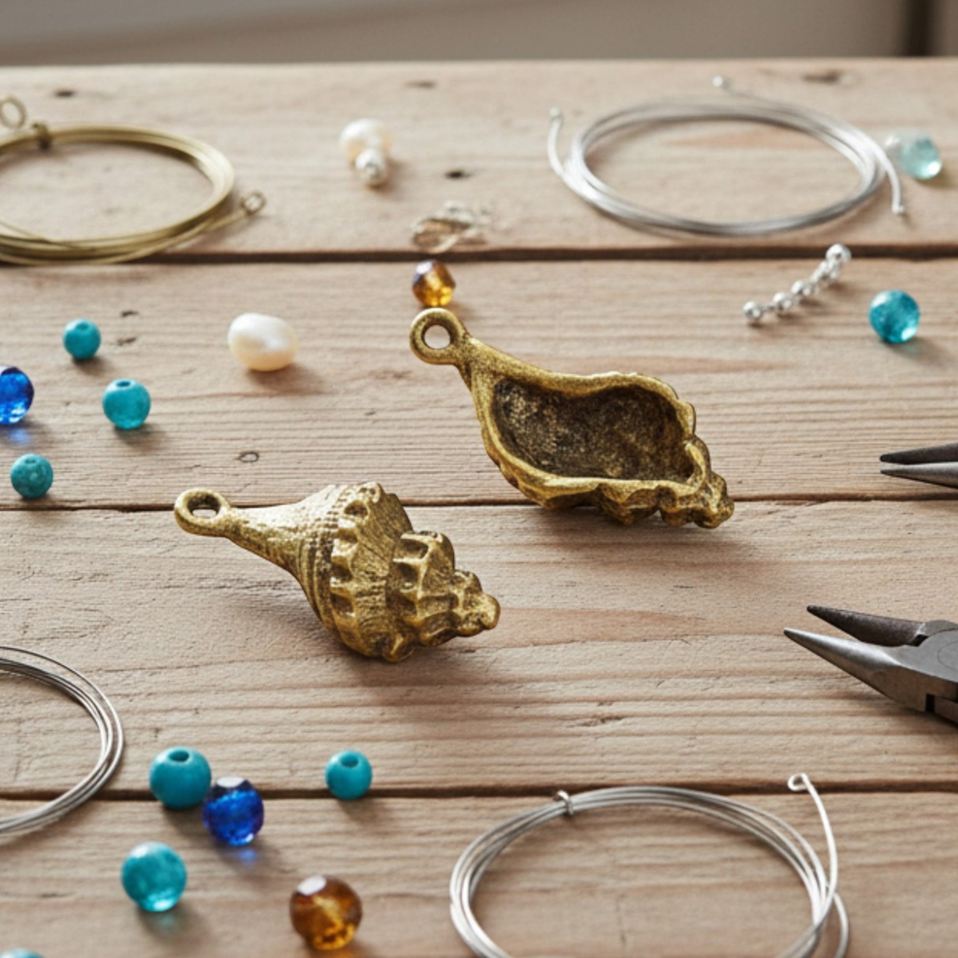 Hackberry Creek 24K gold plated pewter trumpet shell charms with intricate detailing. Beach nautical jewelry making supplies.