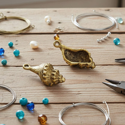 Hackberry Creek 24K gold plated pewter trumpet shell charms with intricate detailing. Beach nautical jewelry making supplies.