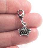 silver crown clip on charm in hand